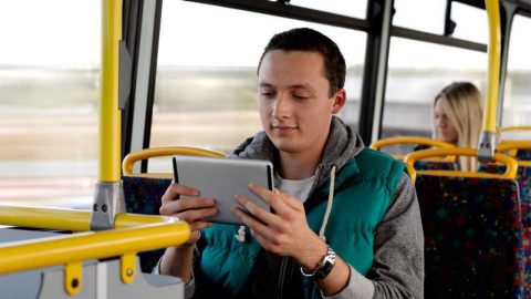 Employee using their device whilst travelling on a bus