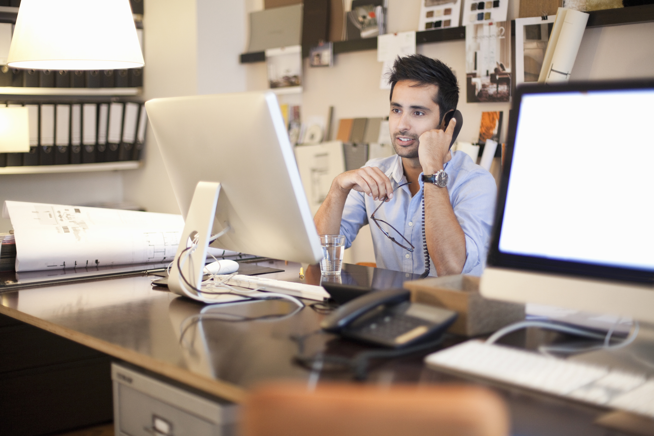 A man in the office on phone
