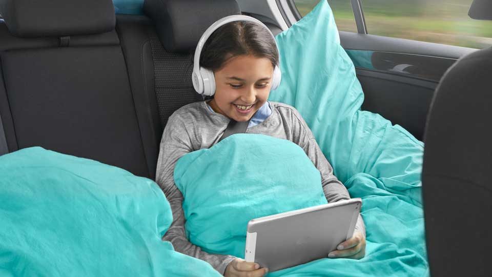 Child in the car on a device