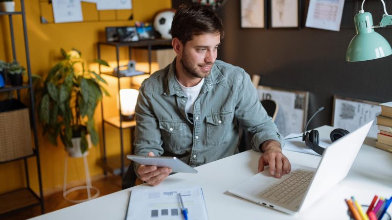 man in home office on laptop