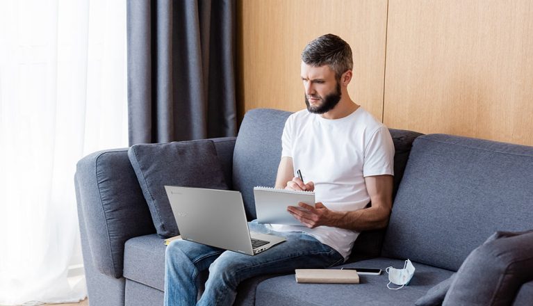 Image of a busy looking man working from home on the Acer Chromebook Spin 513