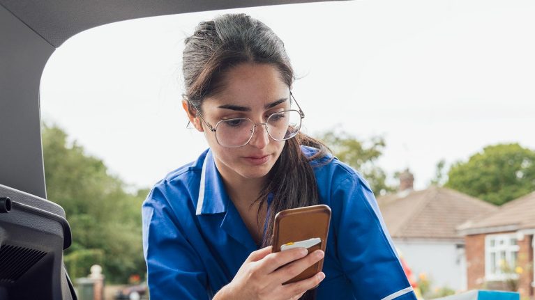 Female nurse using a mobile phone