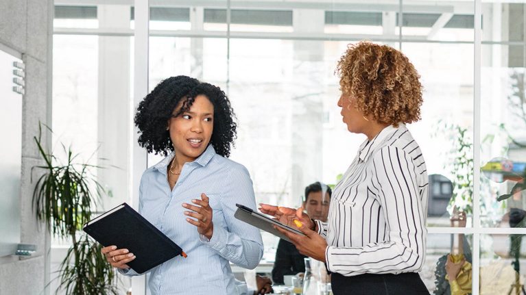 Two women in office