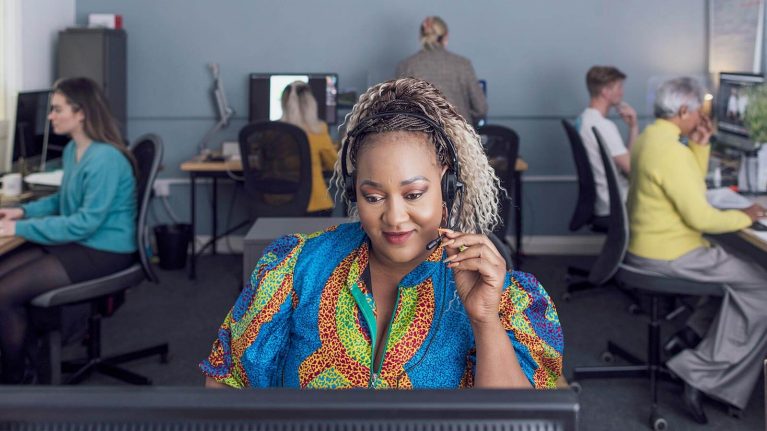 Smiling woman working at her desk