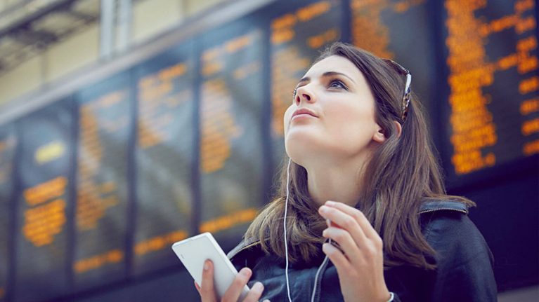 Woman looking up in station