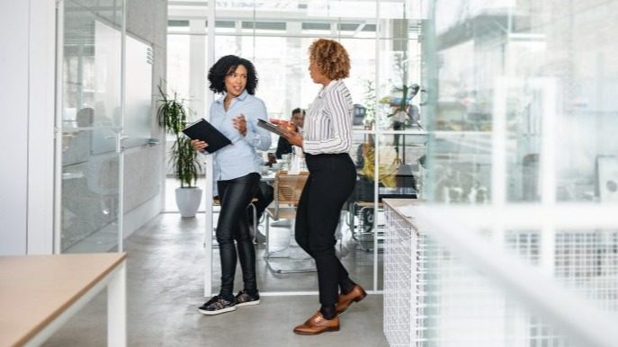 Two women in office