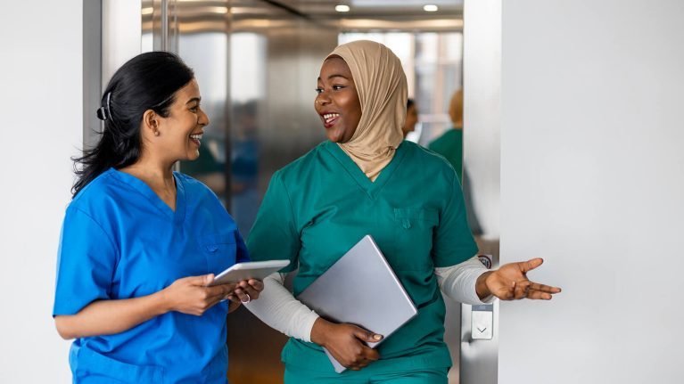 Hospital workers talking to each other